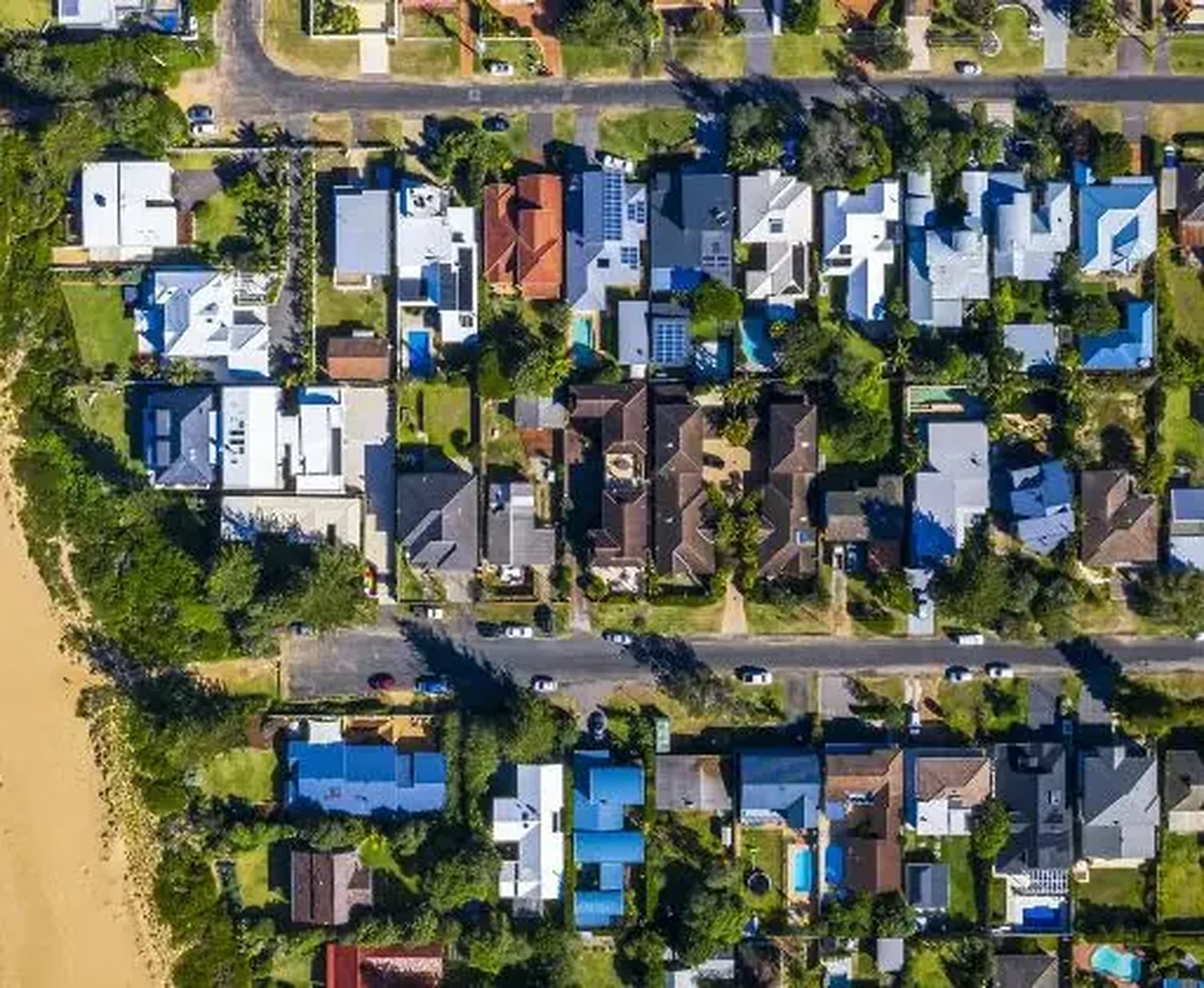 A straight-down aerial view of an Australian suburban street and its houses